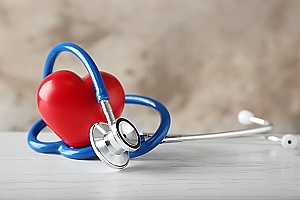 heart with a stethoscope representing self insured plans in health insurance